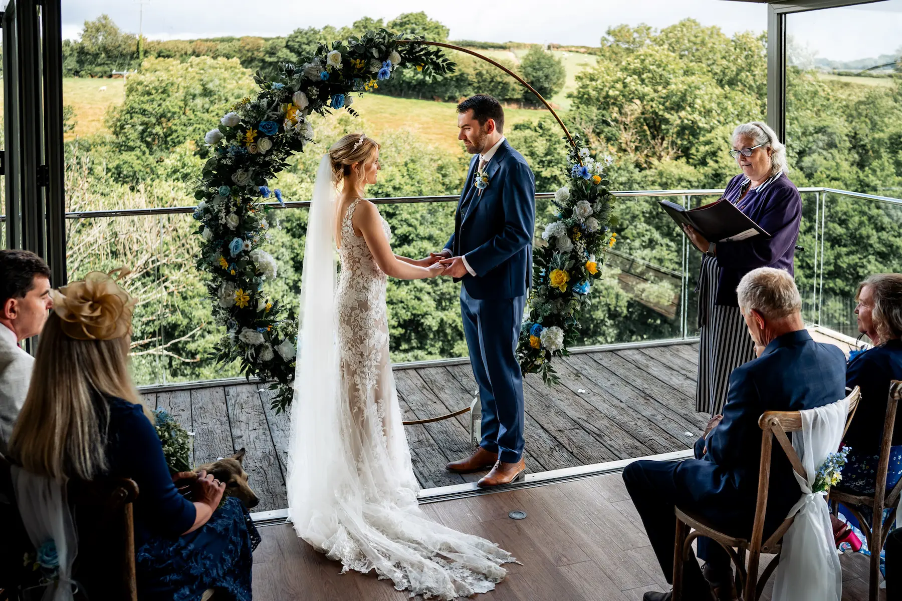 A couple exchanging vows during an intimate wedding ceremony at Tree Top Escape, North Devon