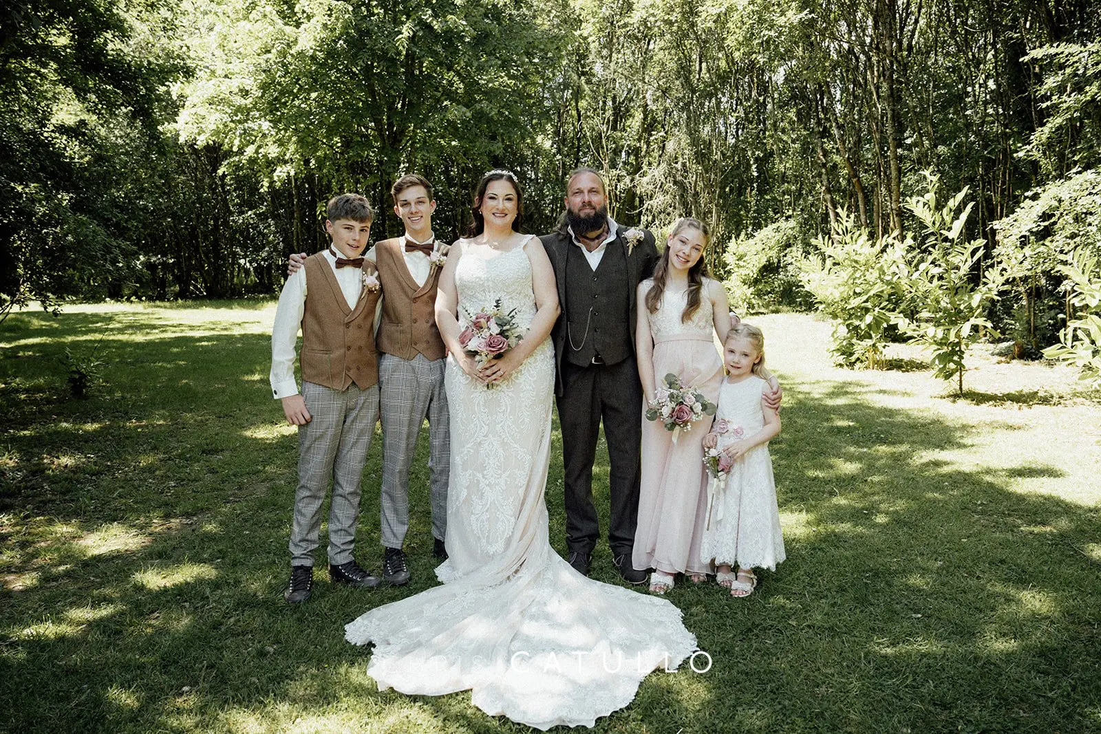 Kelly and Dave with their wedding party at Tree Top Escape, Devon