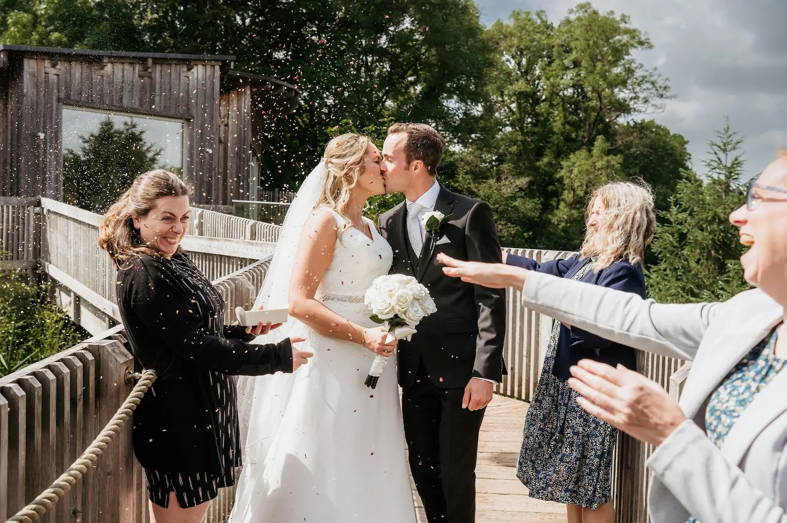 Intimate wedding ceremony at Tree Top Escape, North Devon with the team supporting the couple