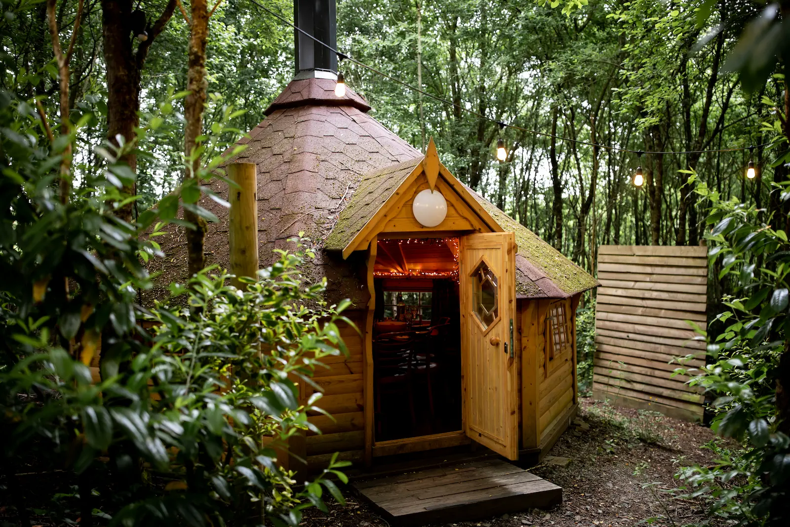 Couples enjoying a unique Grill-Haus dining experience at their wedding at Tree Top Escape Devon